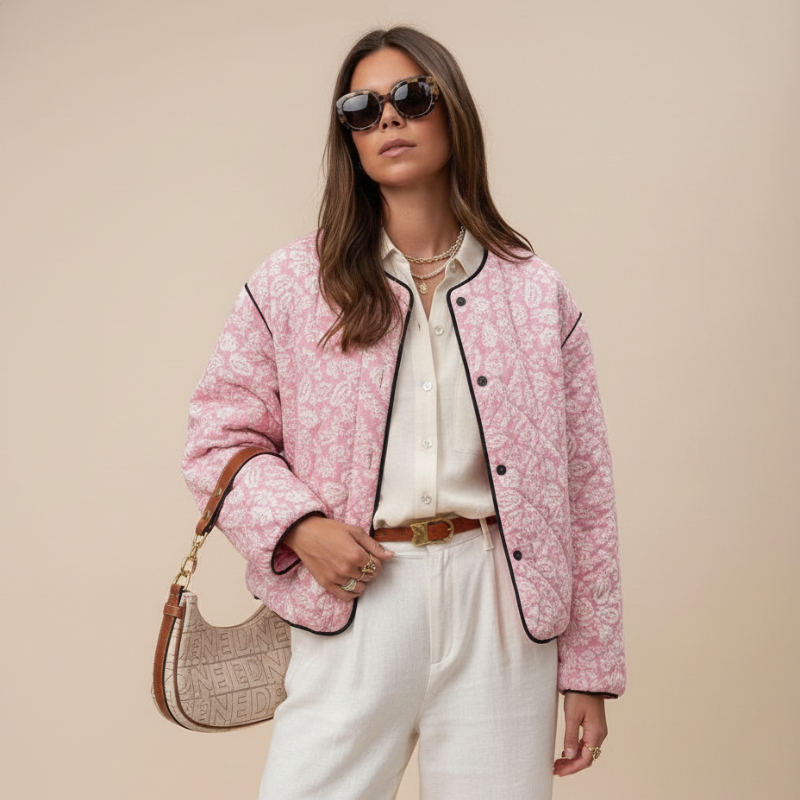 side view of female model wearing pink quilted jacket styled with light neutral clothing